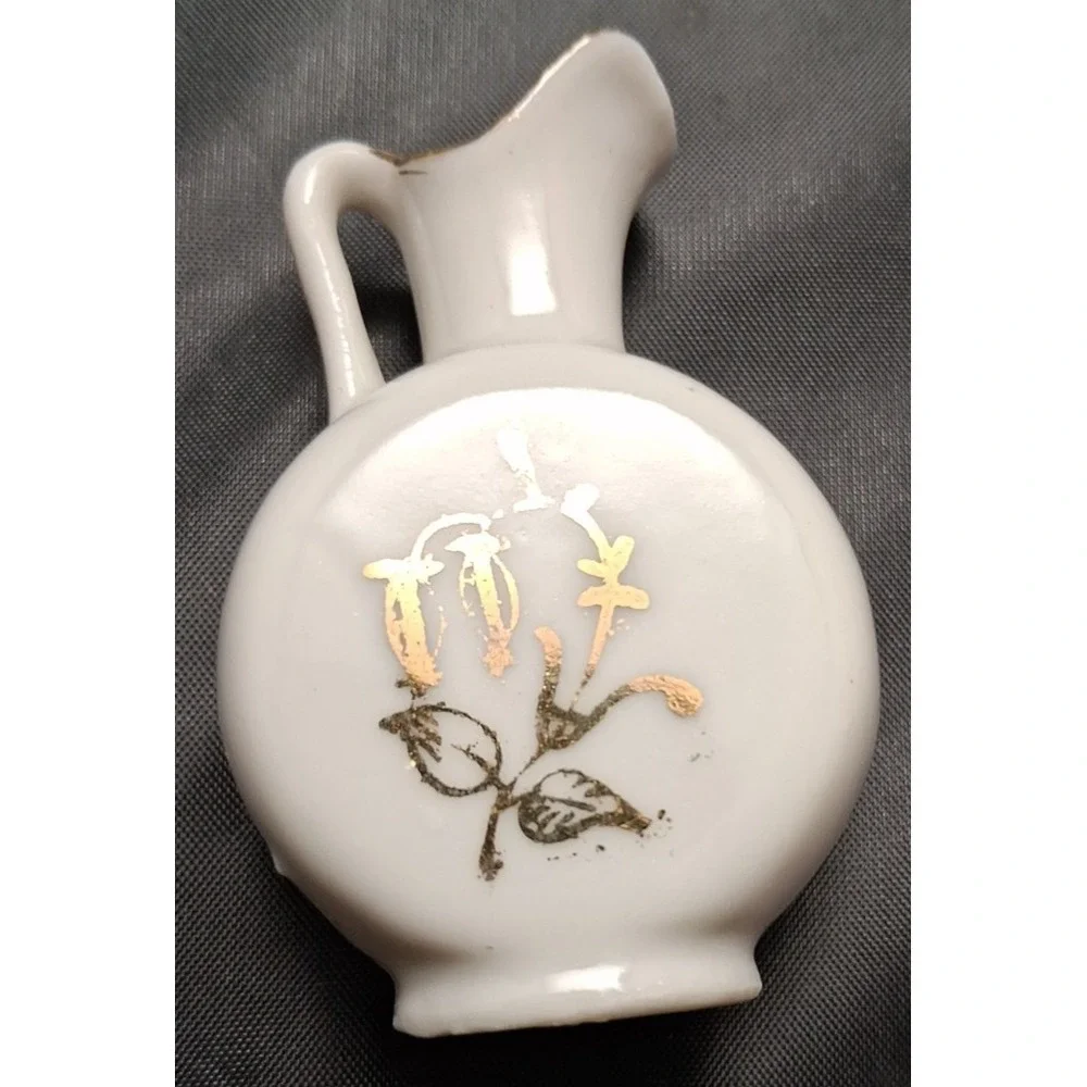 Collection of Seven Vintage Miniature Ceramic Bud Vases with Hand-Painted Design